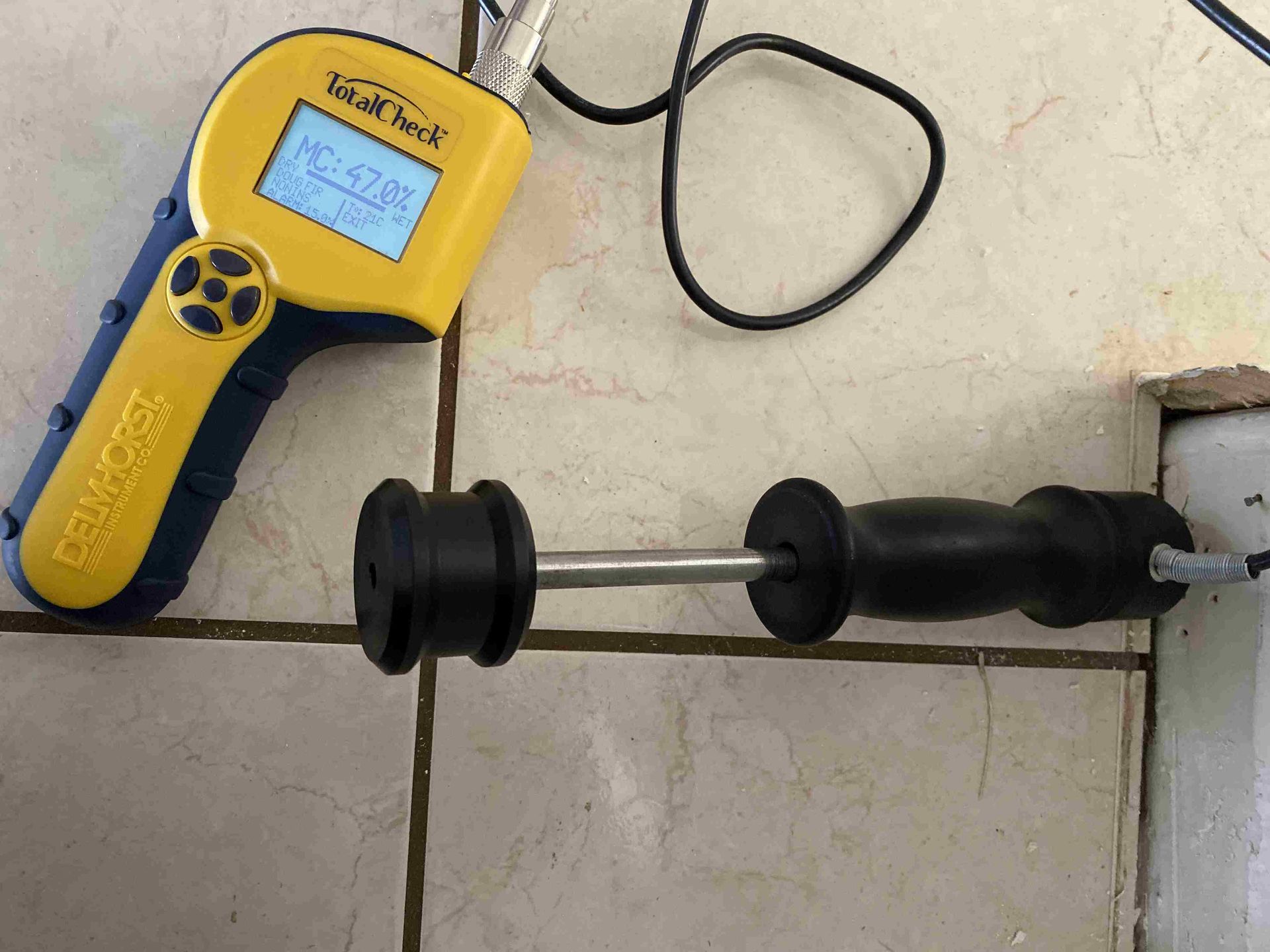 Person holding thermal camera in a casino. Camera shows purple and yellow heat signatures.