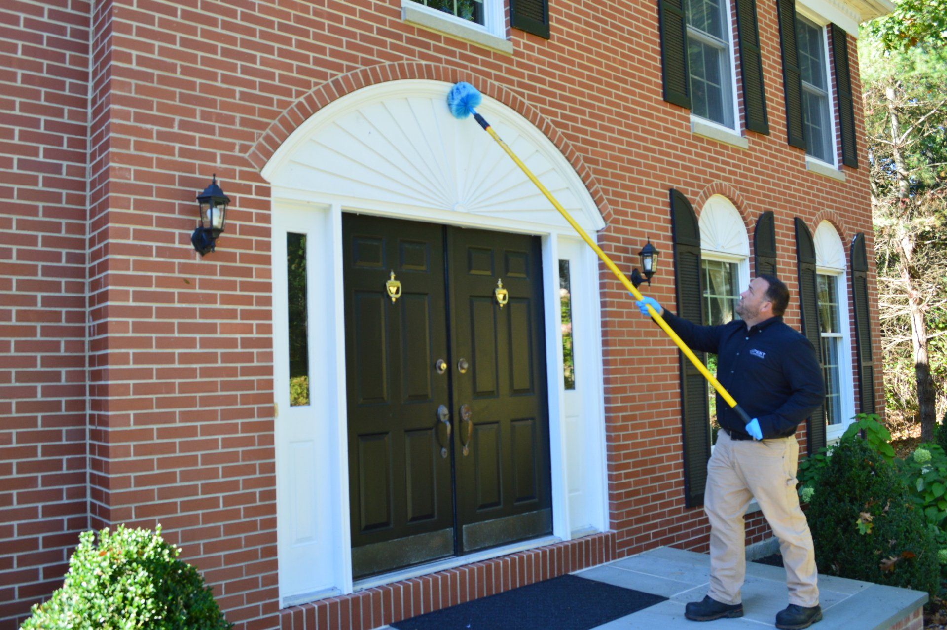 Pest Assassins technician servicing a home for pest control. 