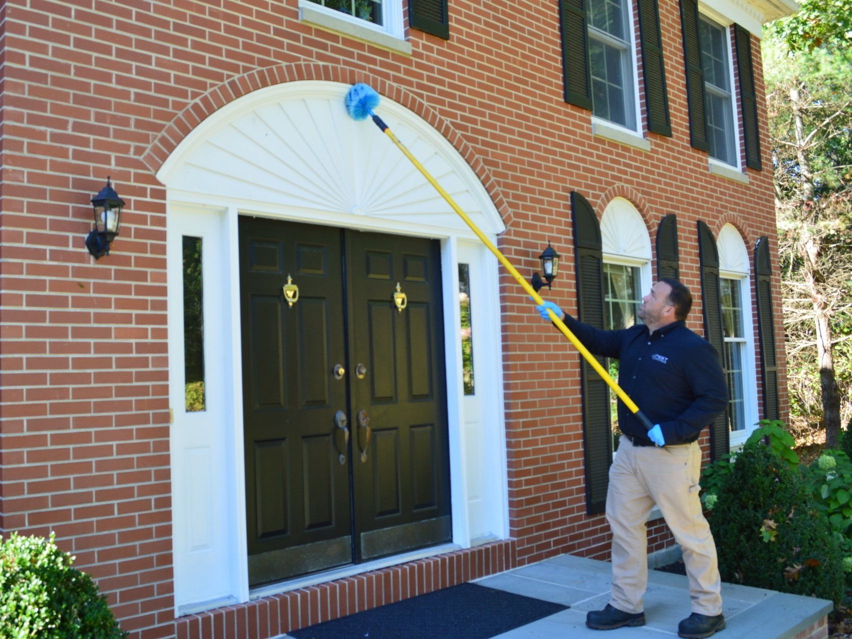 Picture of a Pest Assassins technician performing a home pest inspection.