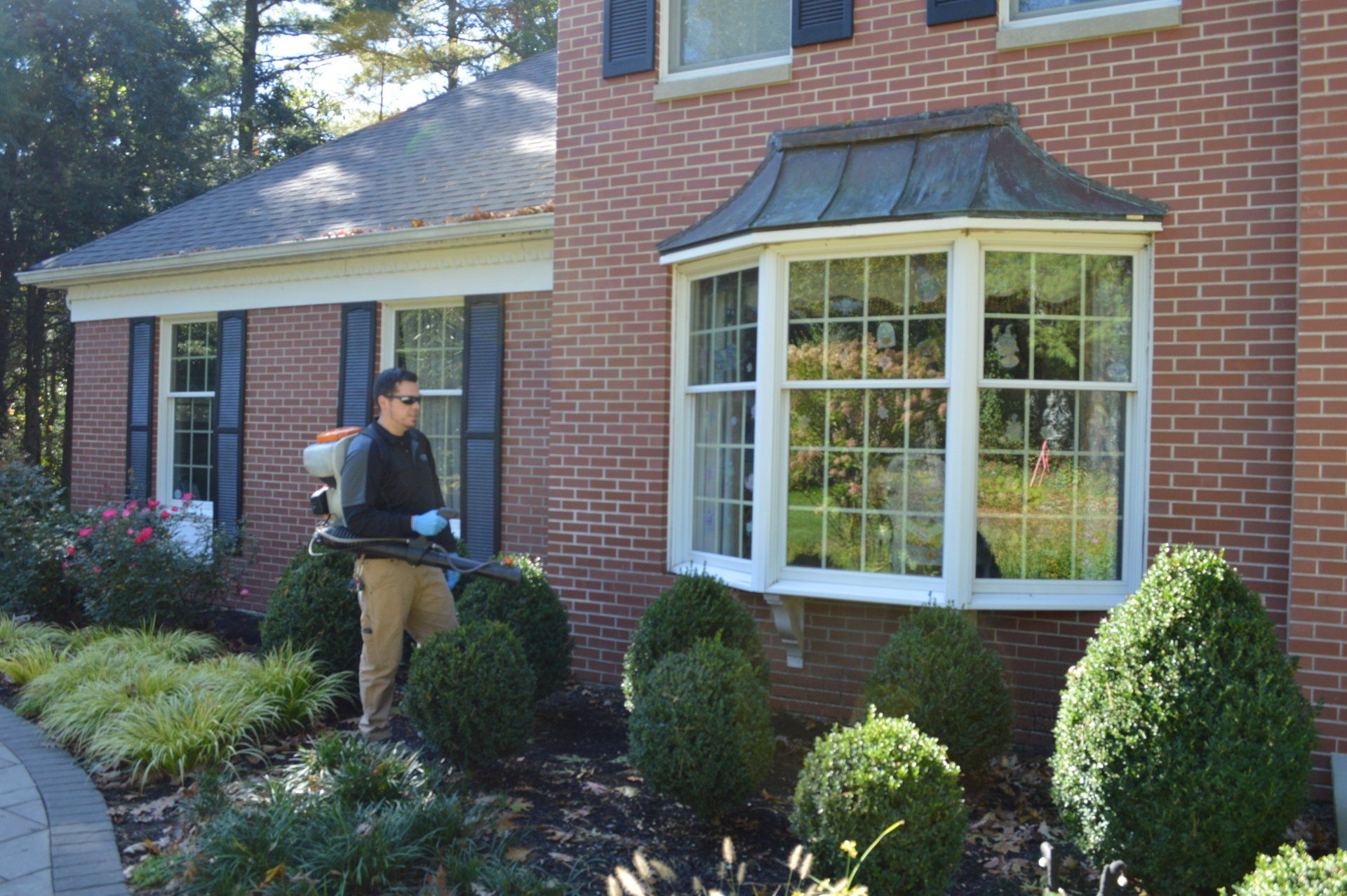 Pest Assassins technician servicing a home for pest control. 