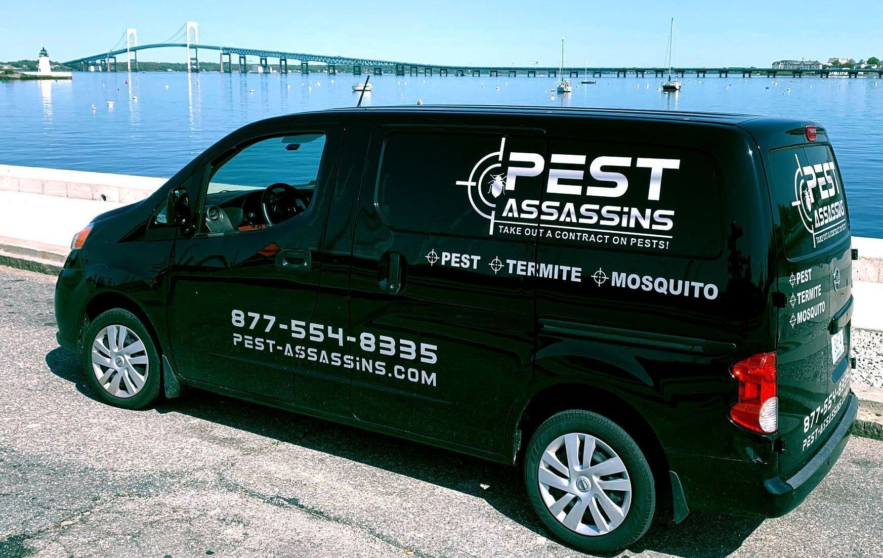 Pest Assassins technician servicing a home for pest control. 