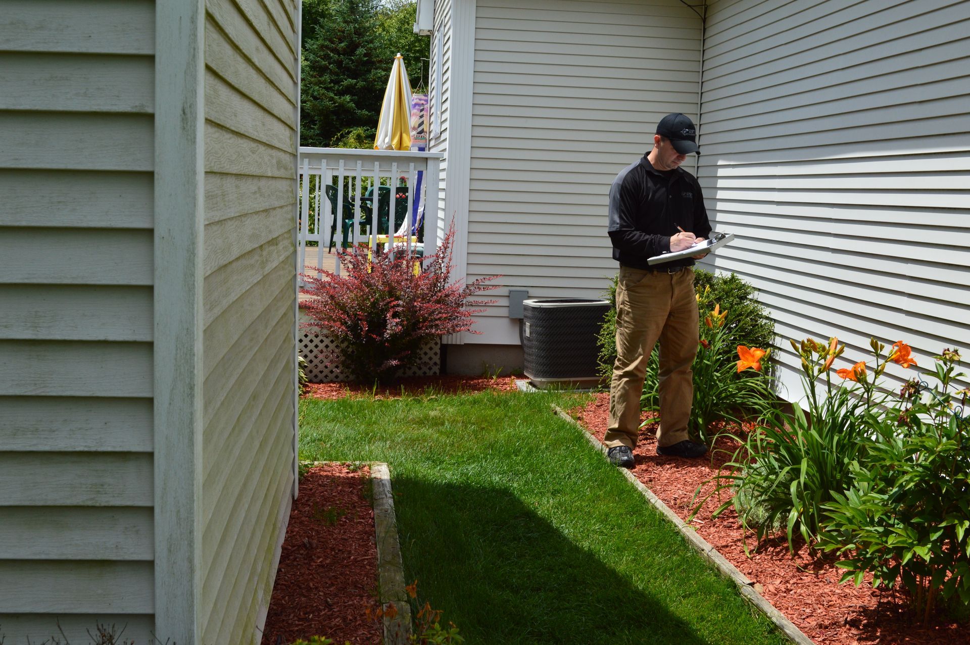 Pest Assassins service technician inspecting a home for rodent control services. 