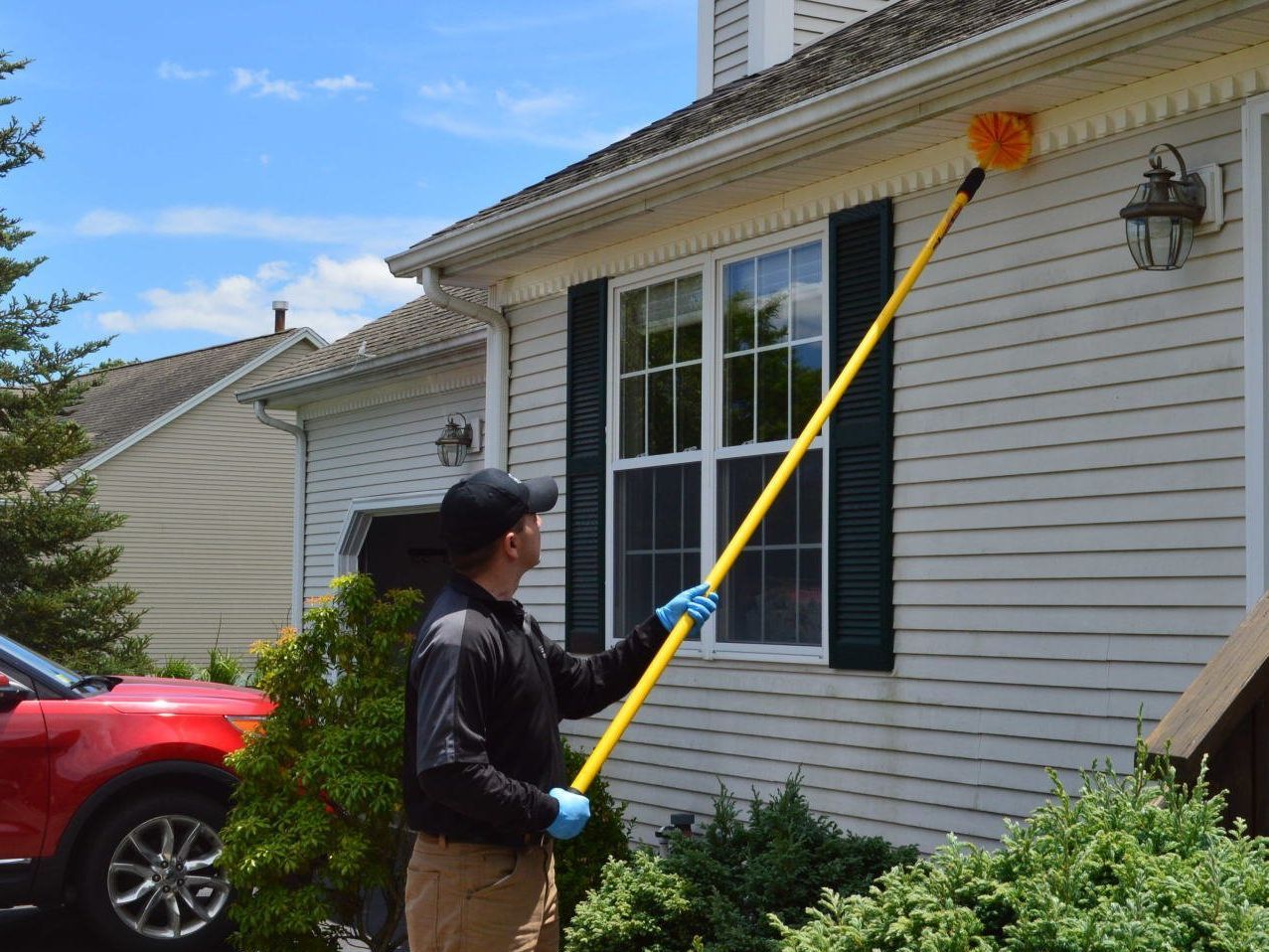 Pest Assassins technician servicing a home for pest control. 