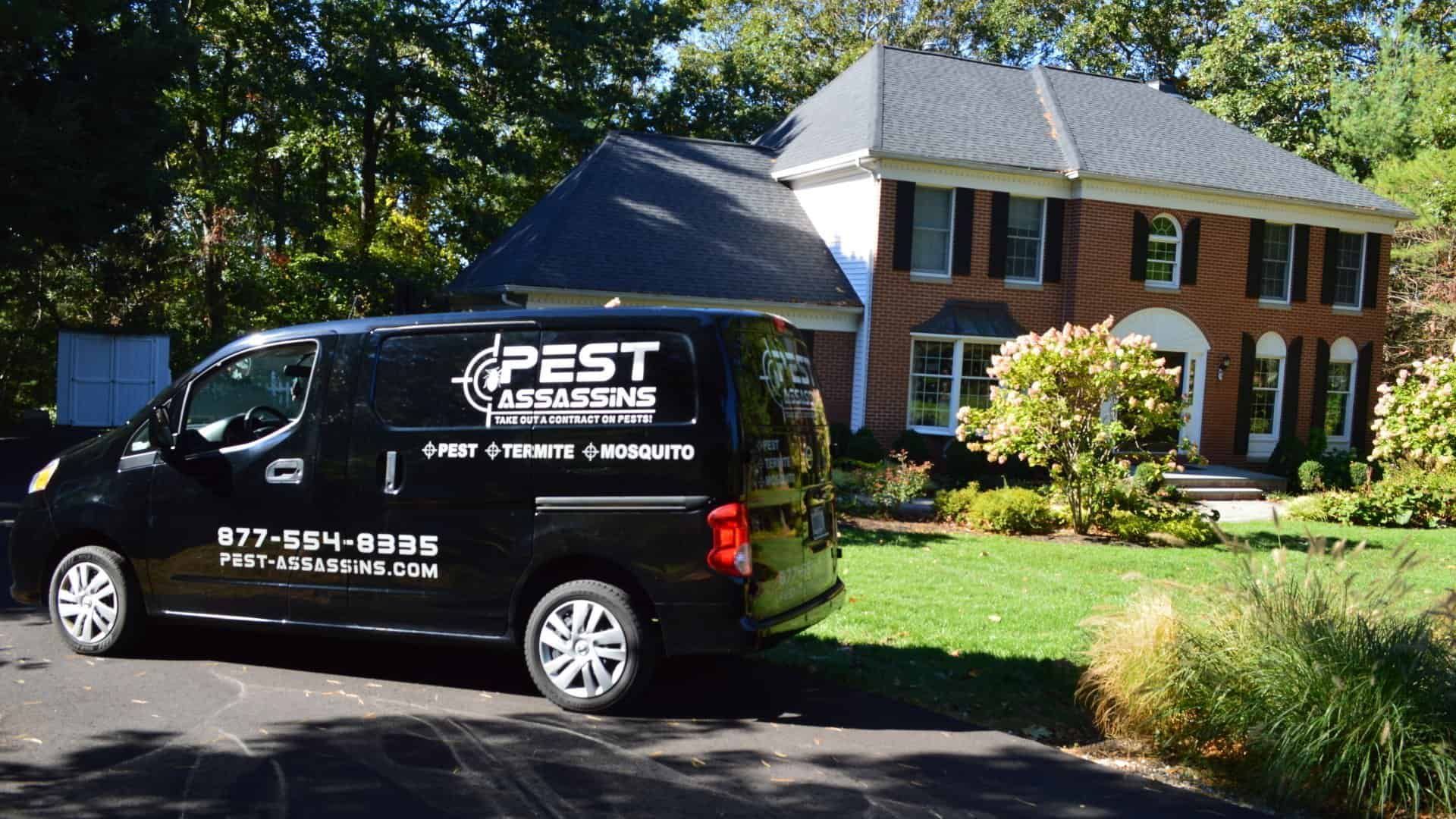 Pest Assassins technician servicing a home for pest control. 