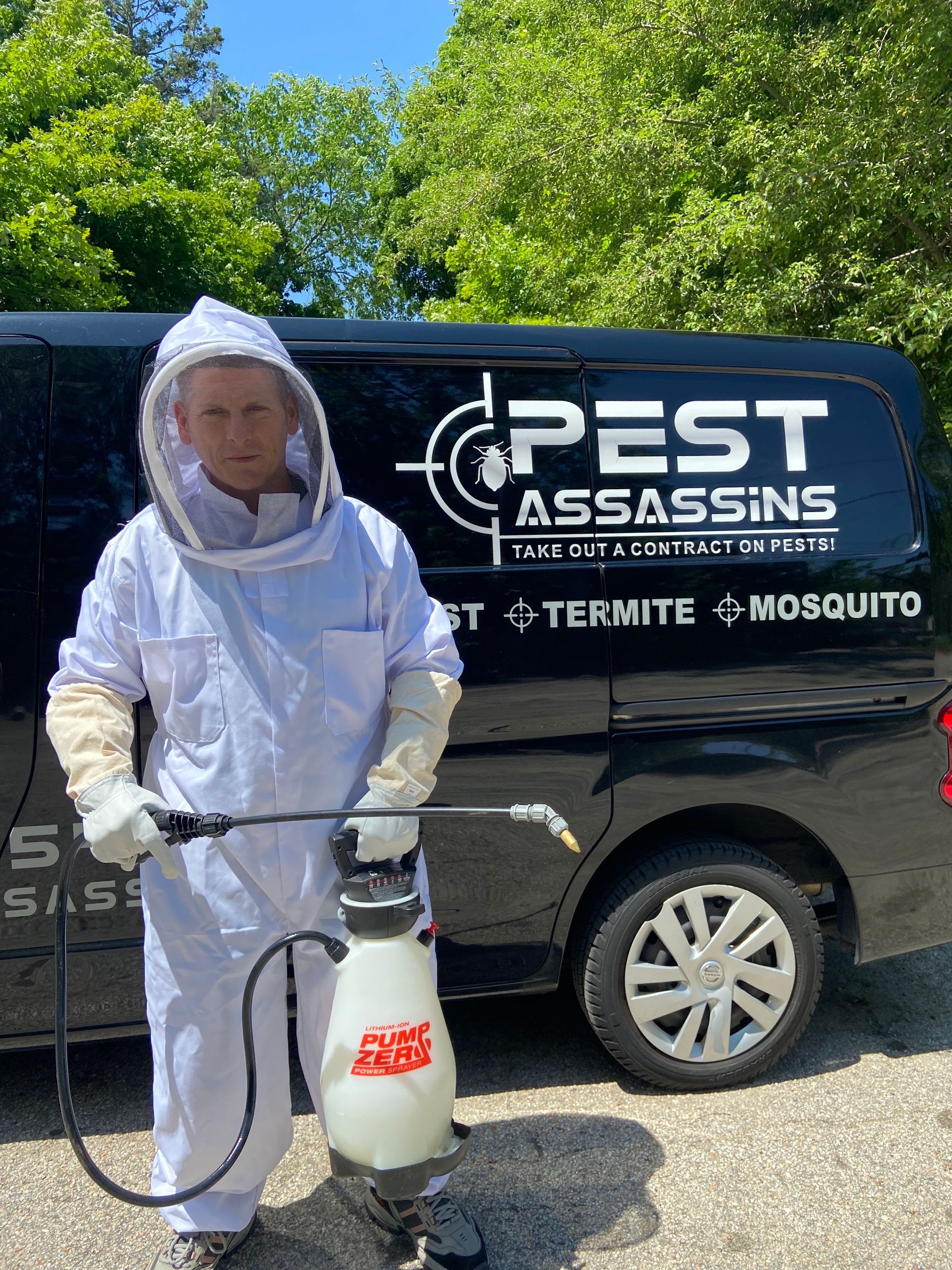 Pest Assassins technician treating a home for ants in Rhode Island