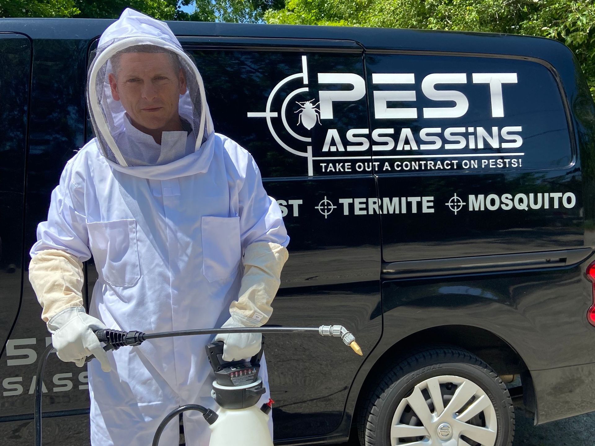 Pest Assassins technician removing a wasp nest in Barrington, Rhode Island. 