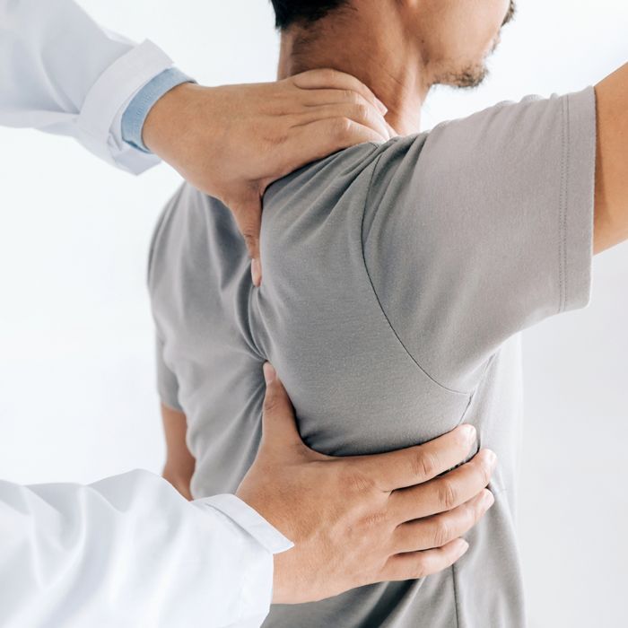 Chiropractor Dealing with Patient's Back — Toowoomba & Roma, QLD — Brownlie Chiropractic