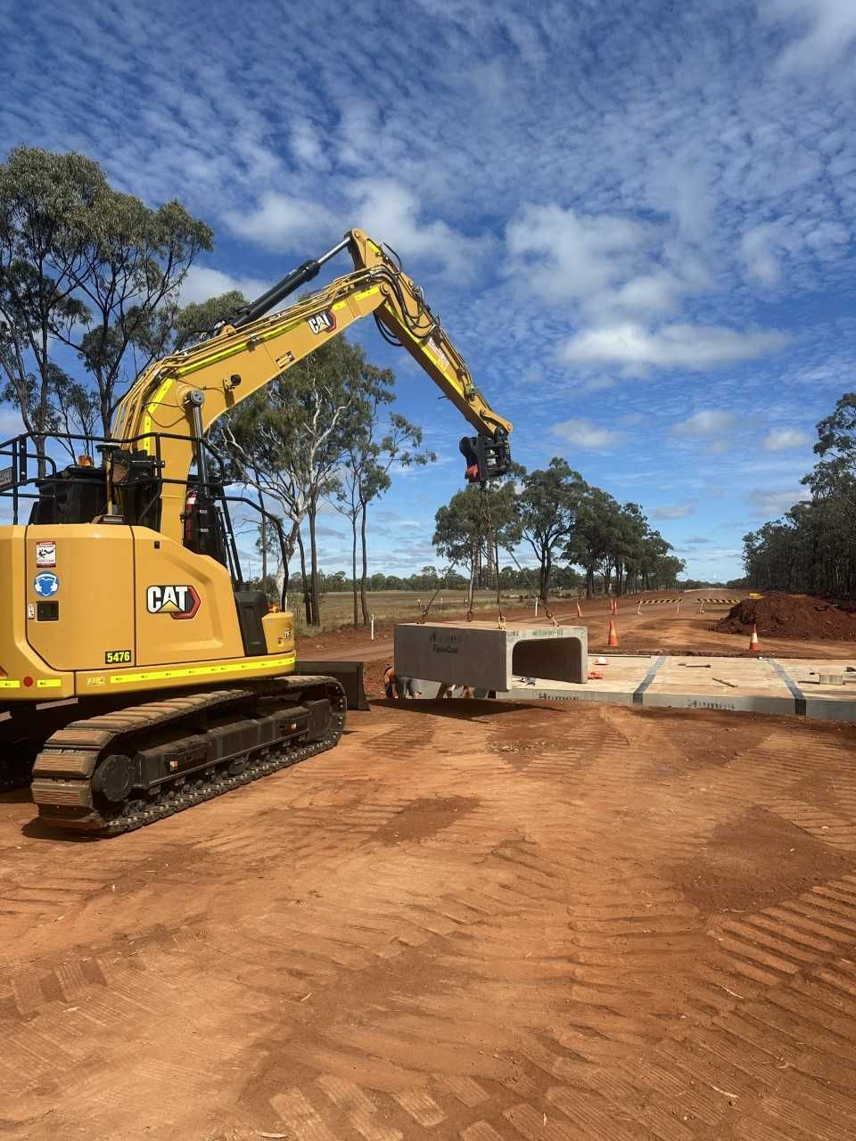 Construction Worker In Orange Hard Hat — Wieland Concreting in Rockhampton, QLD