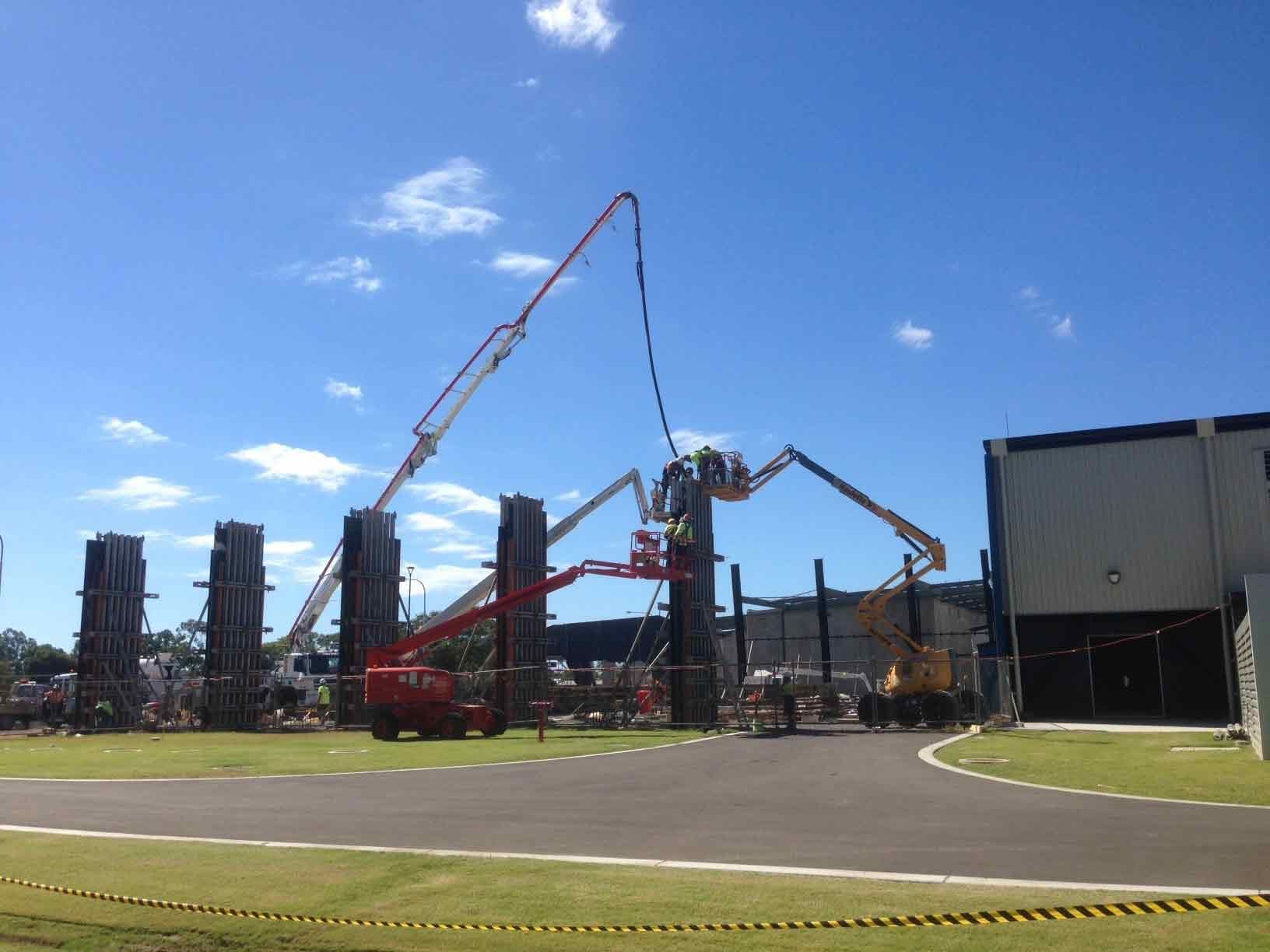 Construction Site With Concrete Pump Trucks — Wieland Concreting in Rockhampton, QLD