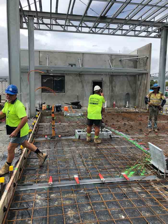 Construction Workers on A Concrete Slab, Setting Rebar and Wires — Wieland Concreting in Rockhampton, QLD