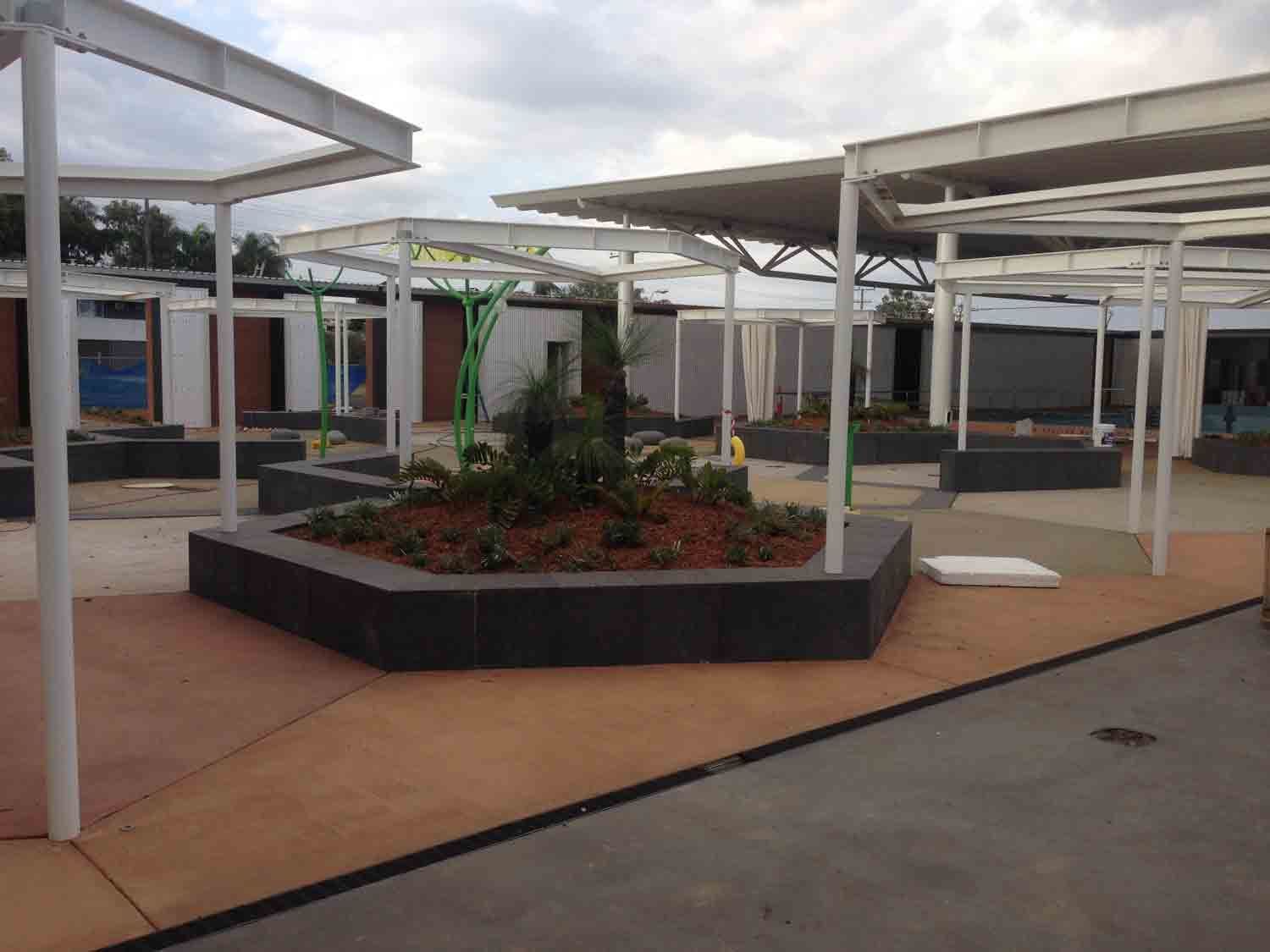 Outdoor Plaza With Hexagonal Planters — Wieland Concreting in Rockhampton, QLD