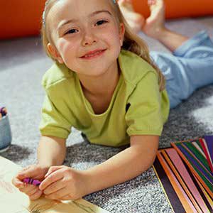 Kid holding a crayon — Wilmington, NC — Kids & Company