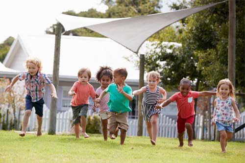 Kids running together — Wilmington, NC — Kids & Company
