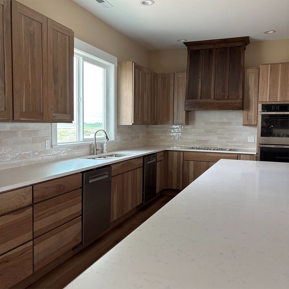 A kitchen with wooden cabinets and stainless steel appliances