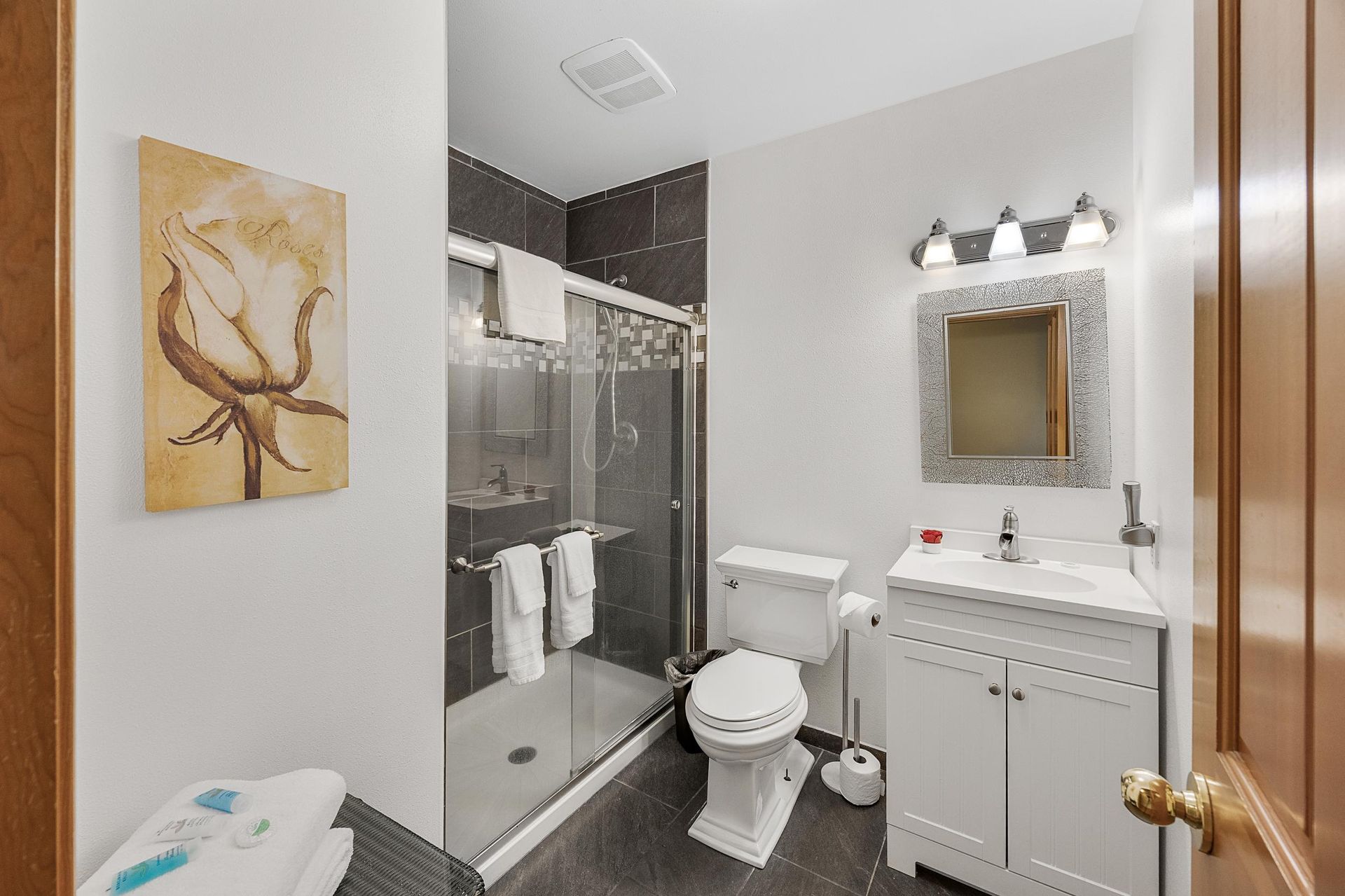 A sunset over a lake with a bridge in the distance