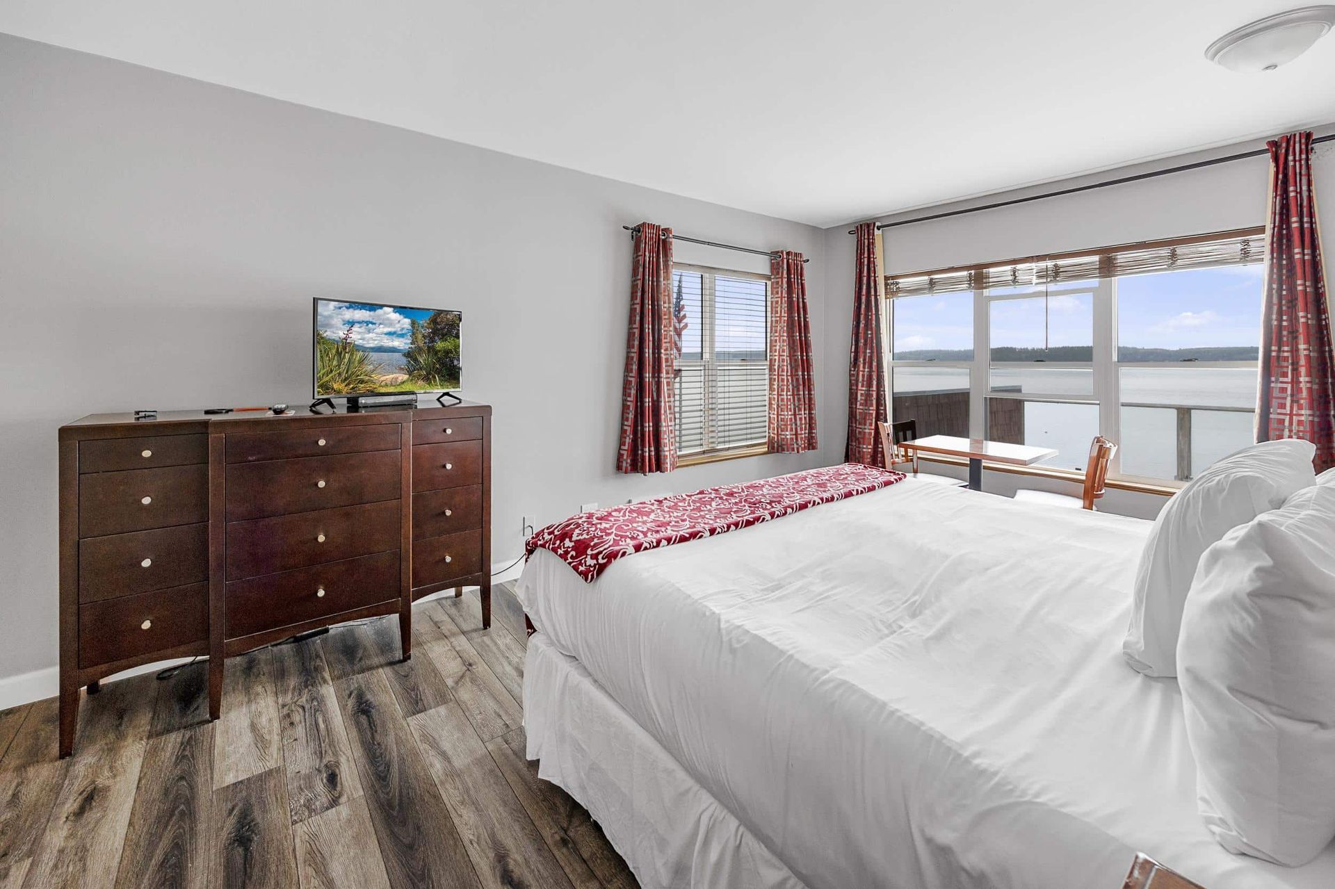 A bathroom with a toilet , sink , and shower.
