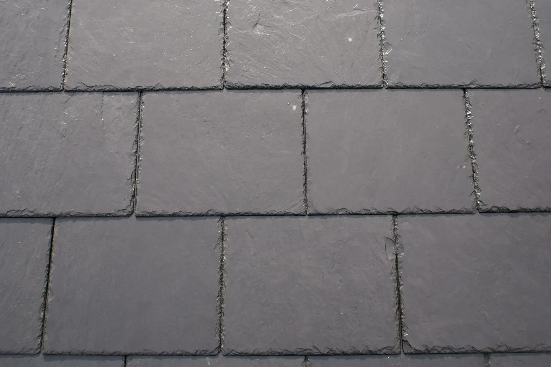 A close up of a roof made of slate tiles.
