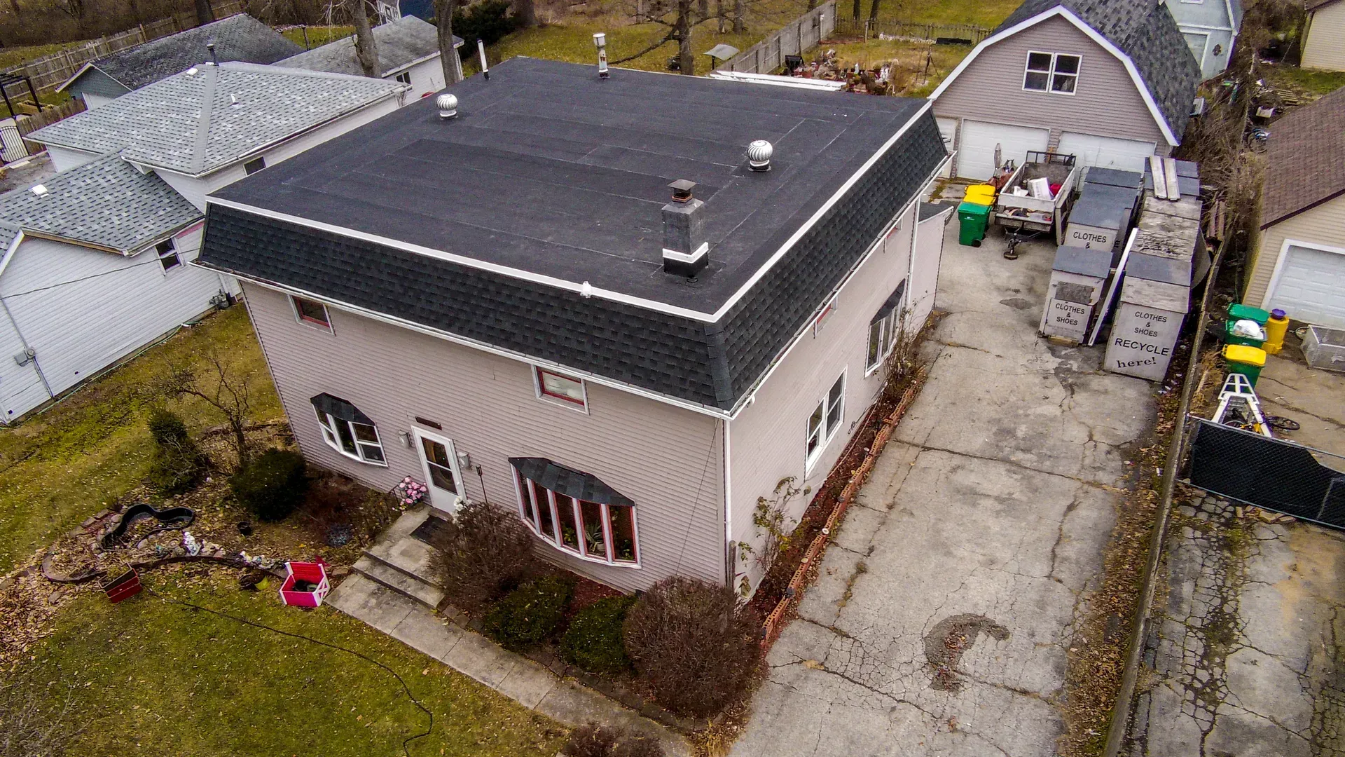 An aerial view of a house with a flat roof.