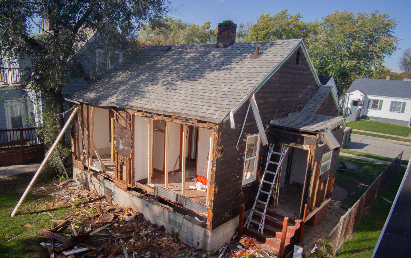 An aerial view of a house that is being demolished.