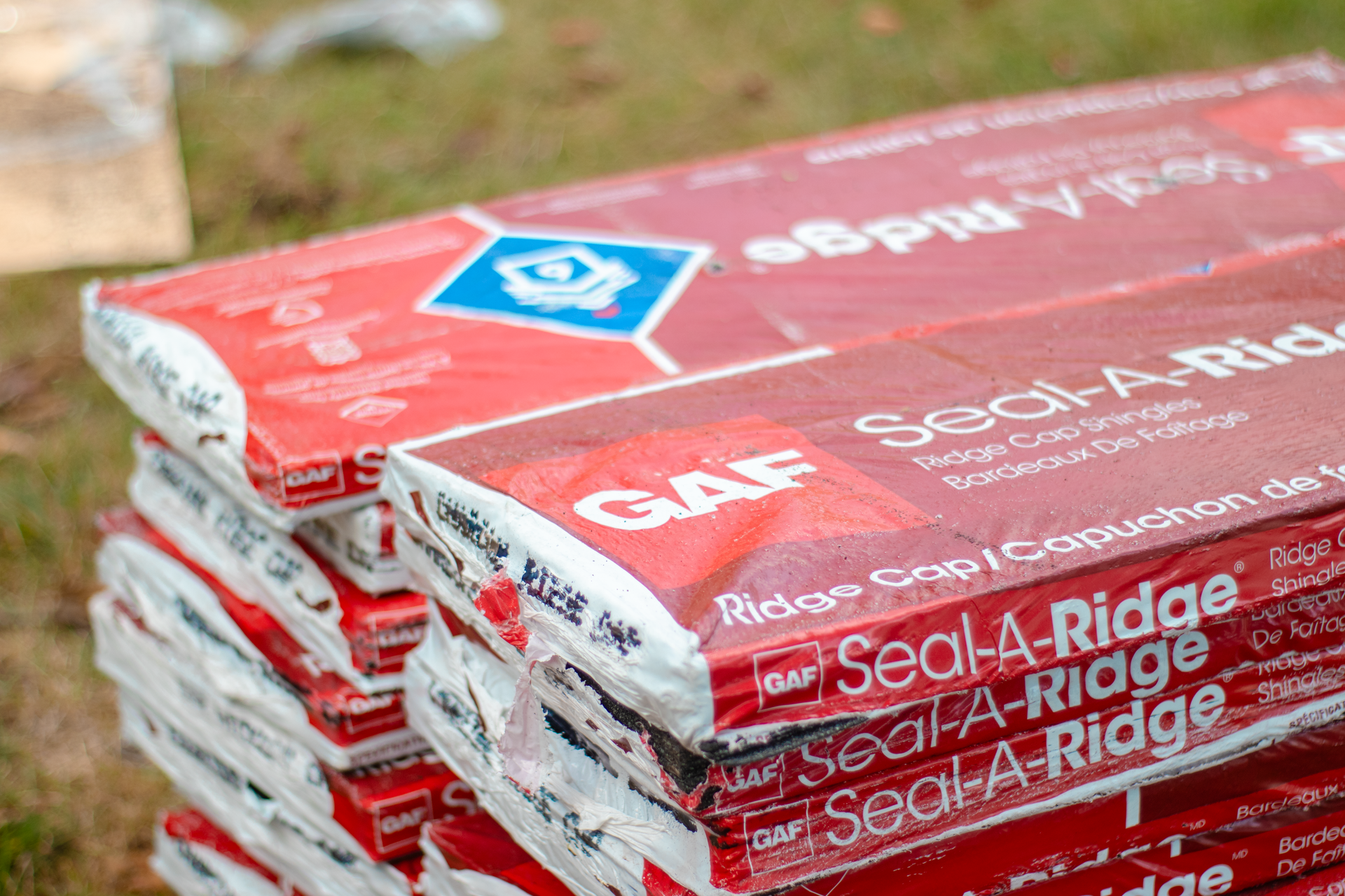 A stack of bags of seal a ridge sitting on top of each other.