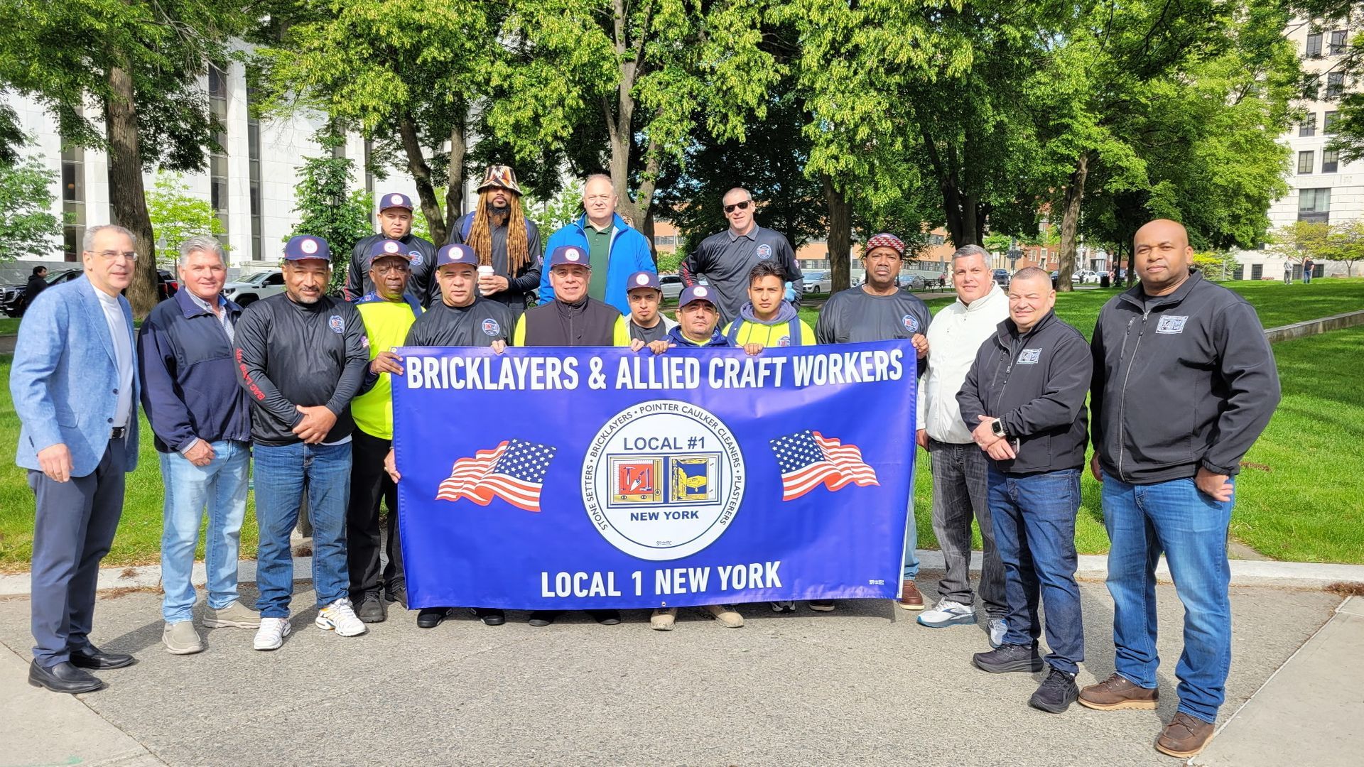Group of union workers holding banner, 
