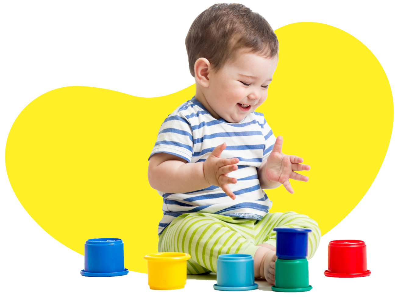 funny baby playing with colourful cup toys on floor