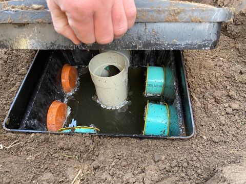 Man Inspecting the Septic Tank — Council Bluffs, IA — Norm's Pumping & Septic Services