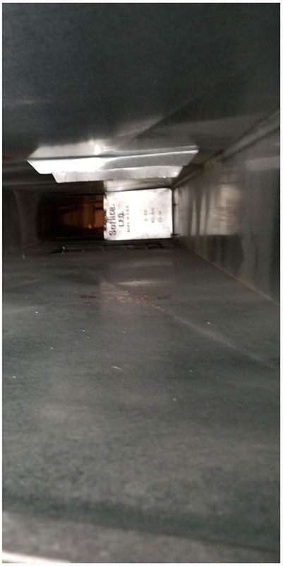 An empty parking garage with a light on the ceiling