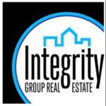 Logo for Integrity Group Real Estate featuring a light blue outline of a house atop black text inside a circular border.