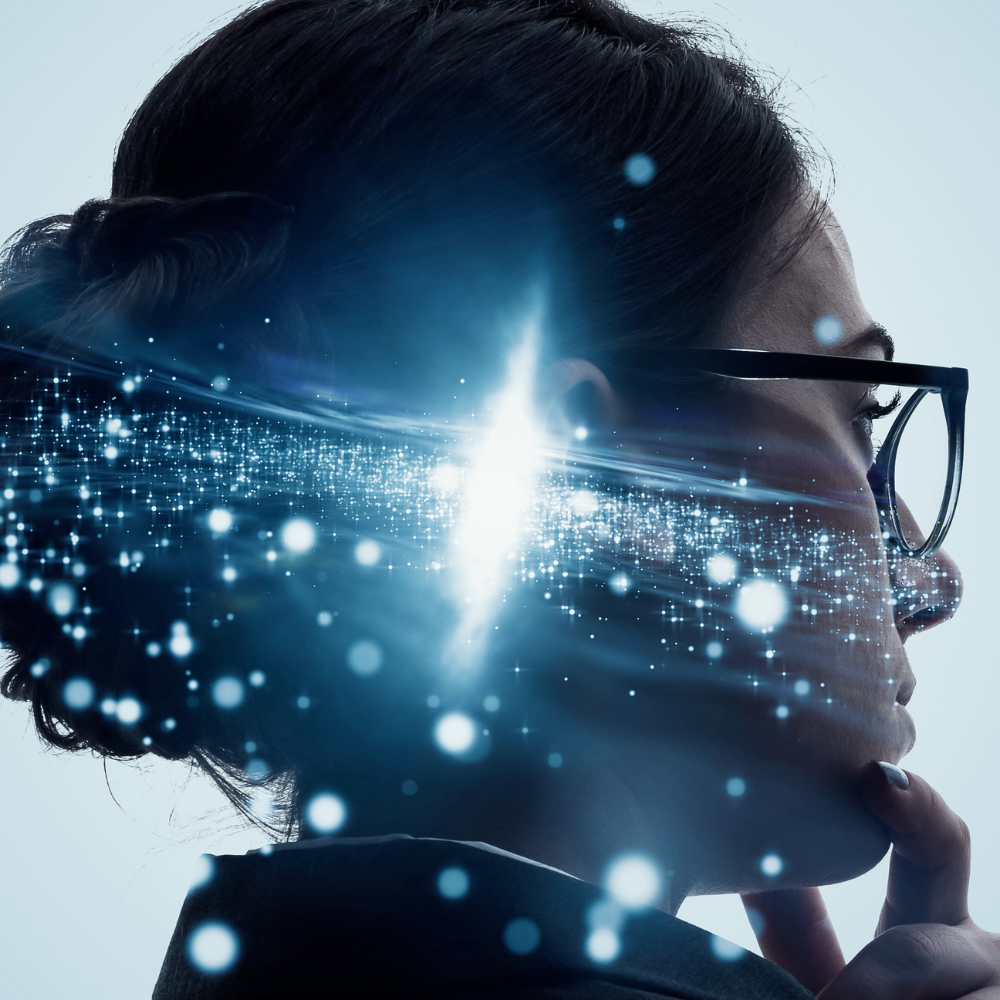 A woman wearing glasses has a light coming out of her head