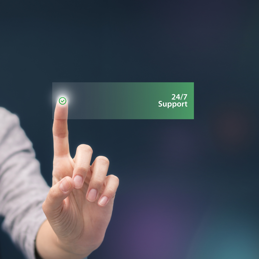 A person is pressing a button that says 24/7 support
