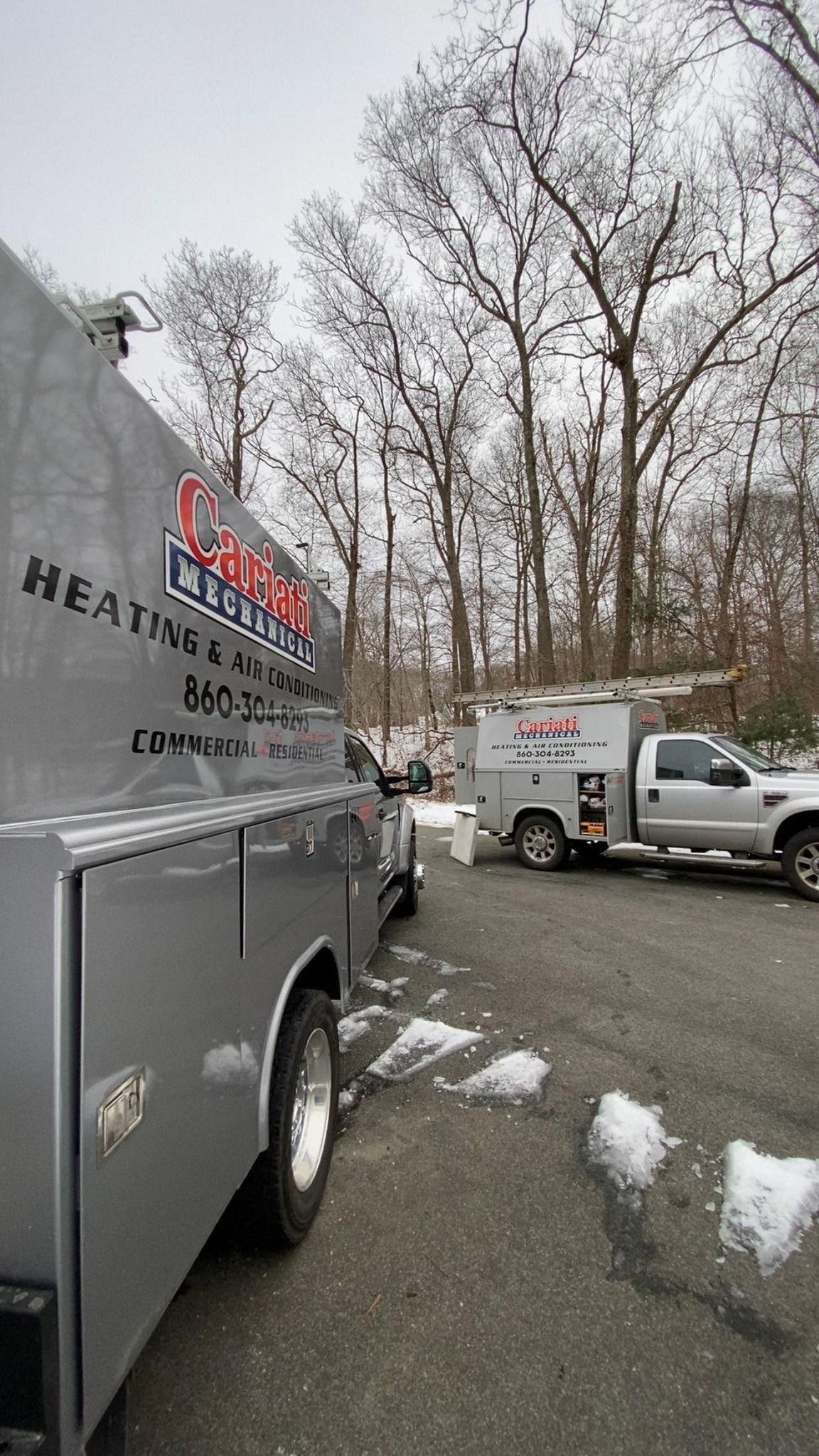 A couple of trucks parked next to each other in a parking lot.