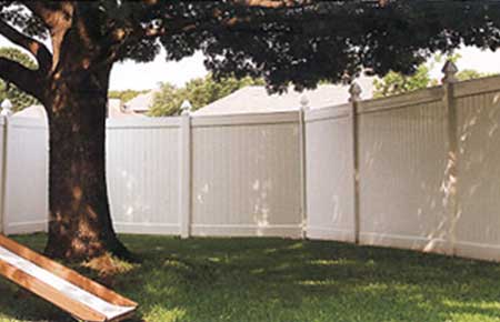 Vinyl Fence Outdoor With A Large Tree — Riverside, CA — Elrod Fence Co