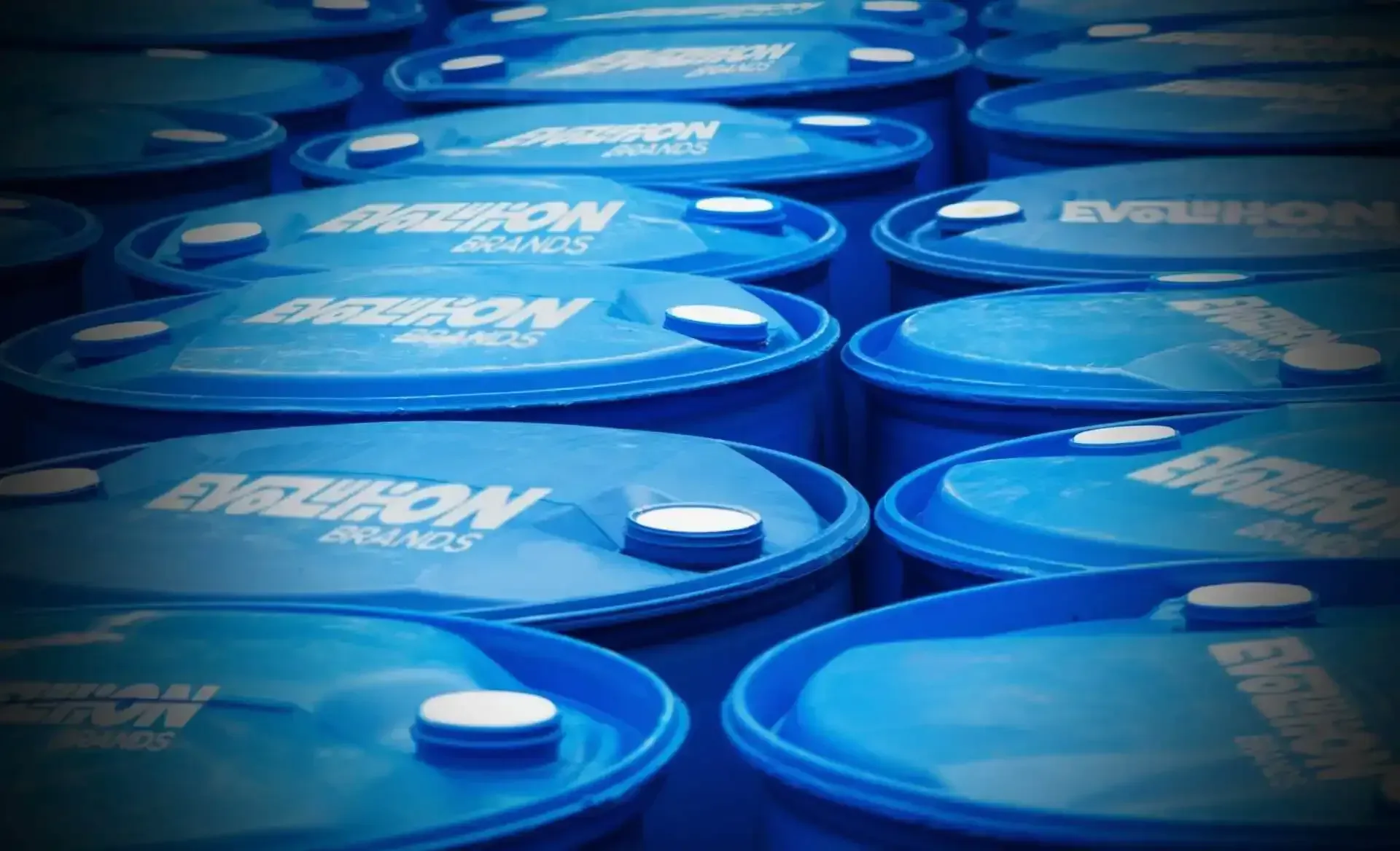 A bunch of blue barrels with the word evolution on them