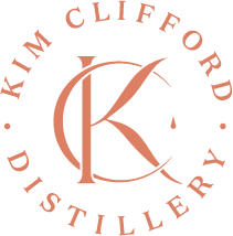 a logo for kim clifford distillery with a letter k in a circle .