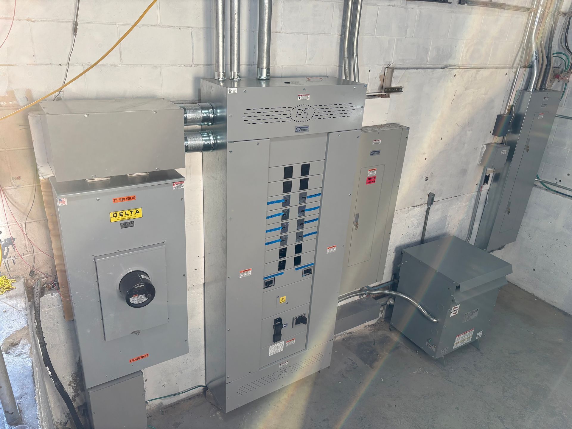 Bedroom with bed, fireplace, wooden floor, gray walls, and ceiling fan.