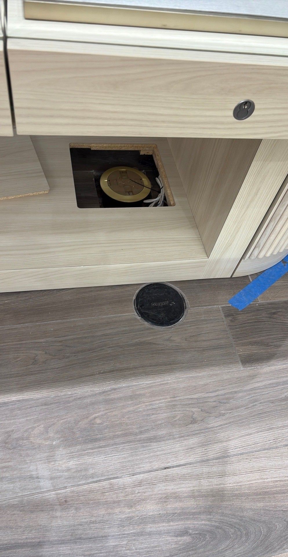 Bedroom with bed, fireplace, wooden floor, gray walls, and ceiling fan.