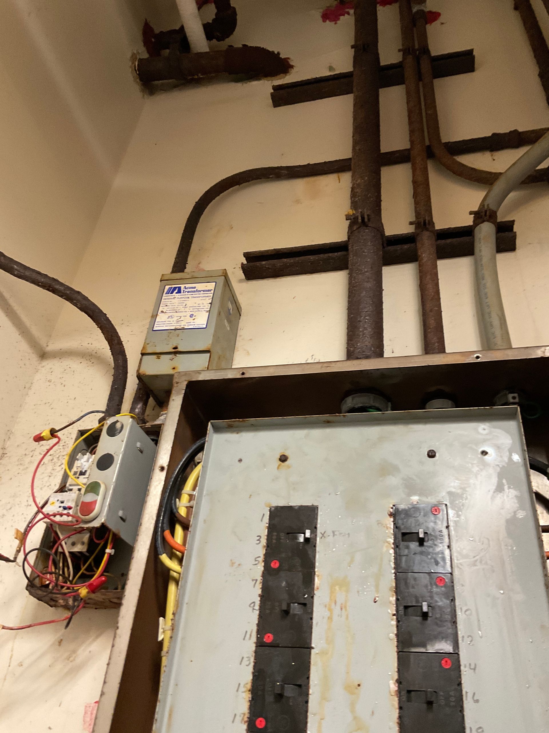 Bedroom with bed, fireplace, wooden floor, gray walls, and ceiling fan.