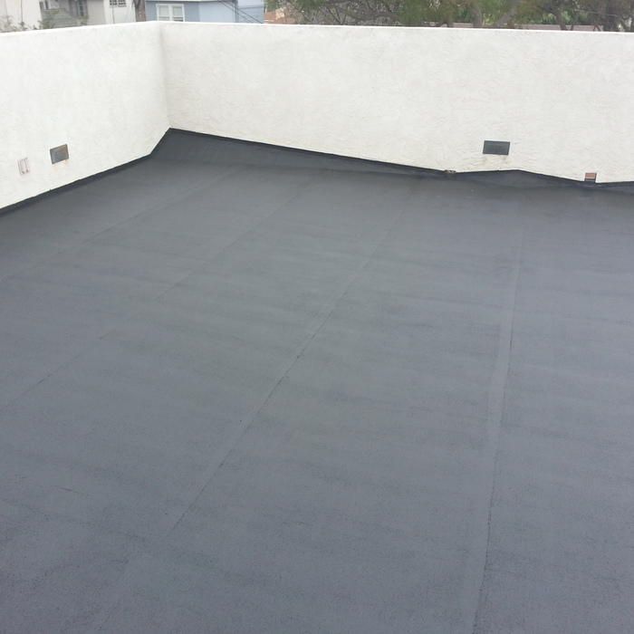 Dark gray flat roof with white walls.