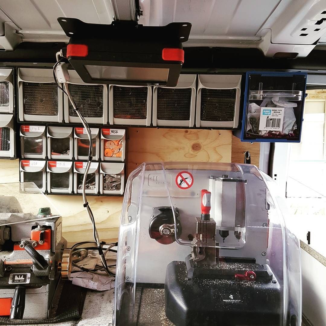 A Key Cutting Machine In A Van With A Warning Sign On It — Barwon Locksmith & Security Doors in Grovedale, VIC
