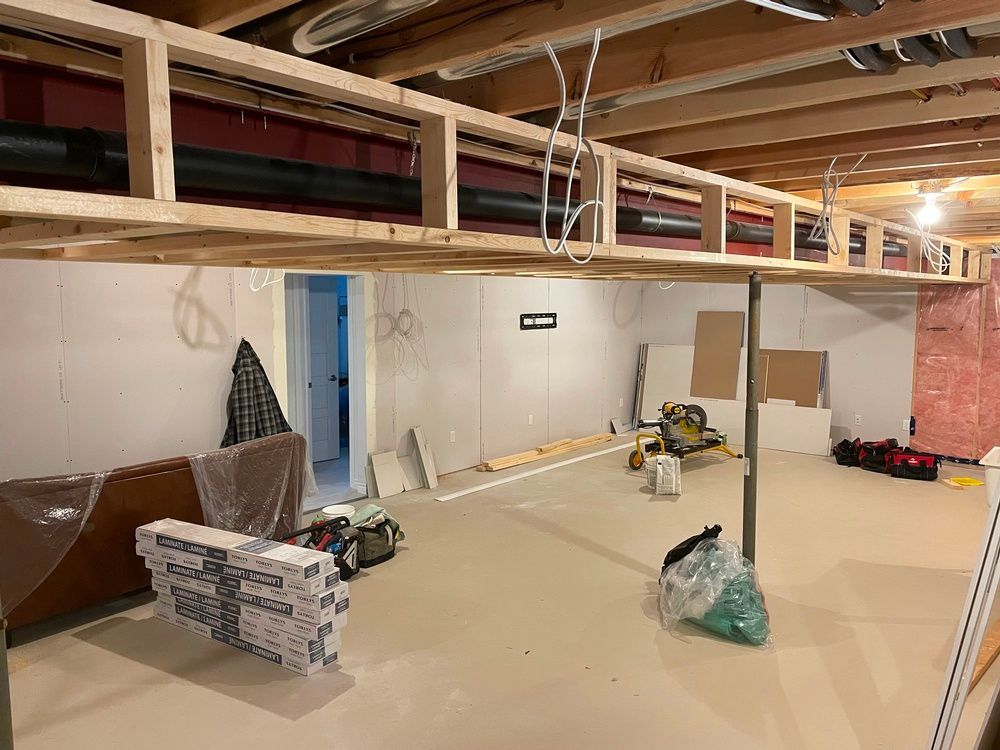 A basement is being remodeled with a wooden ceiling.