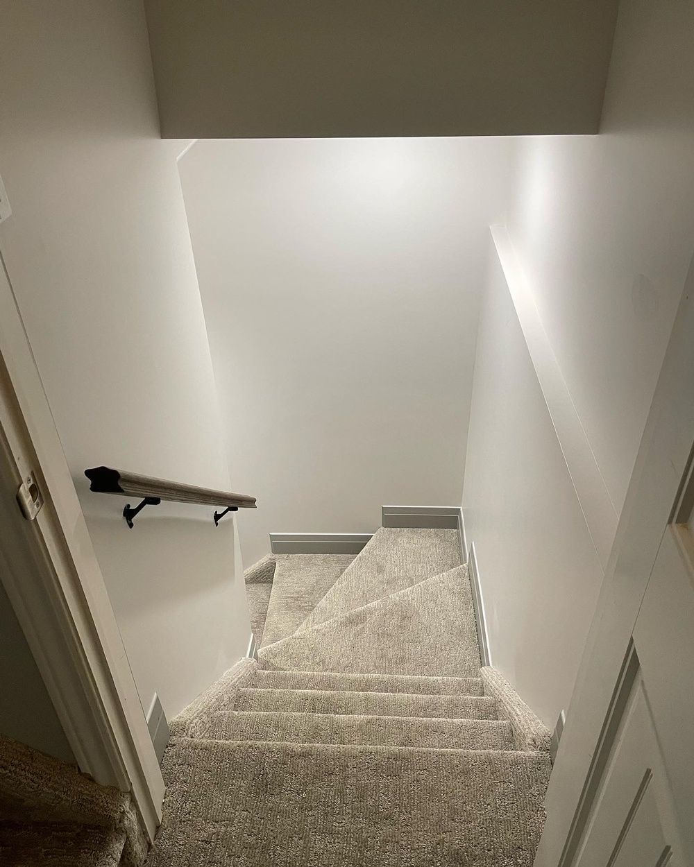 A set of stairs leading up to the second floor of a house.