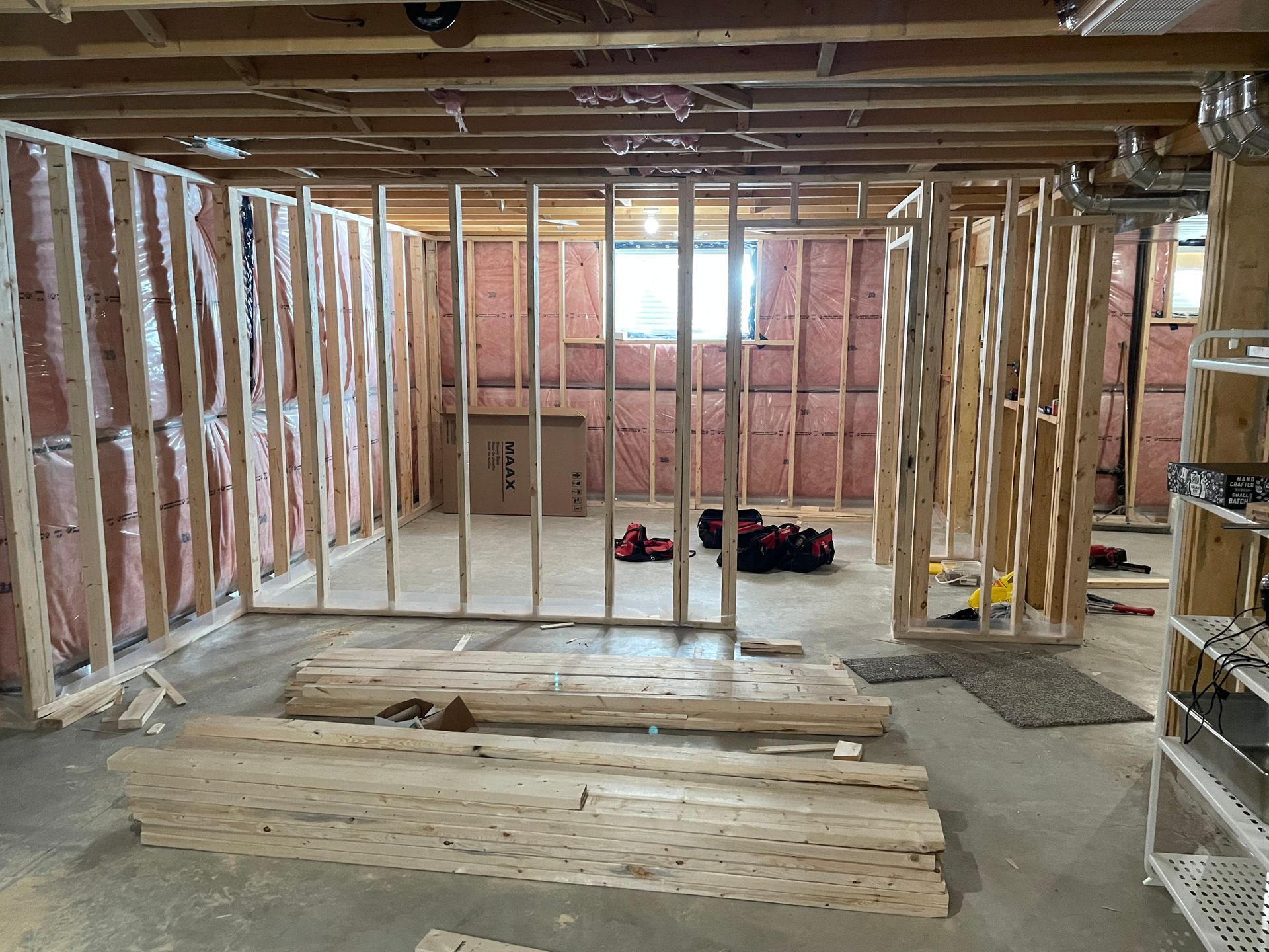A basement is being built with wooden frames and insulation.