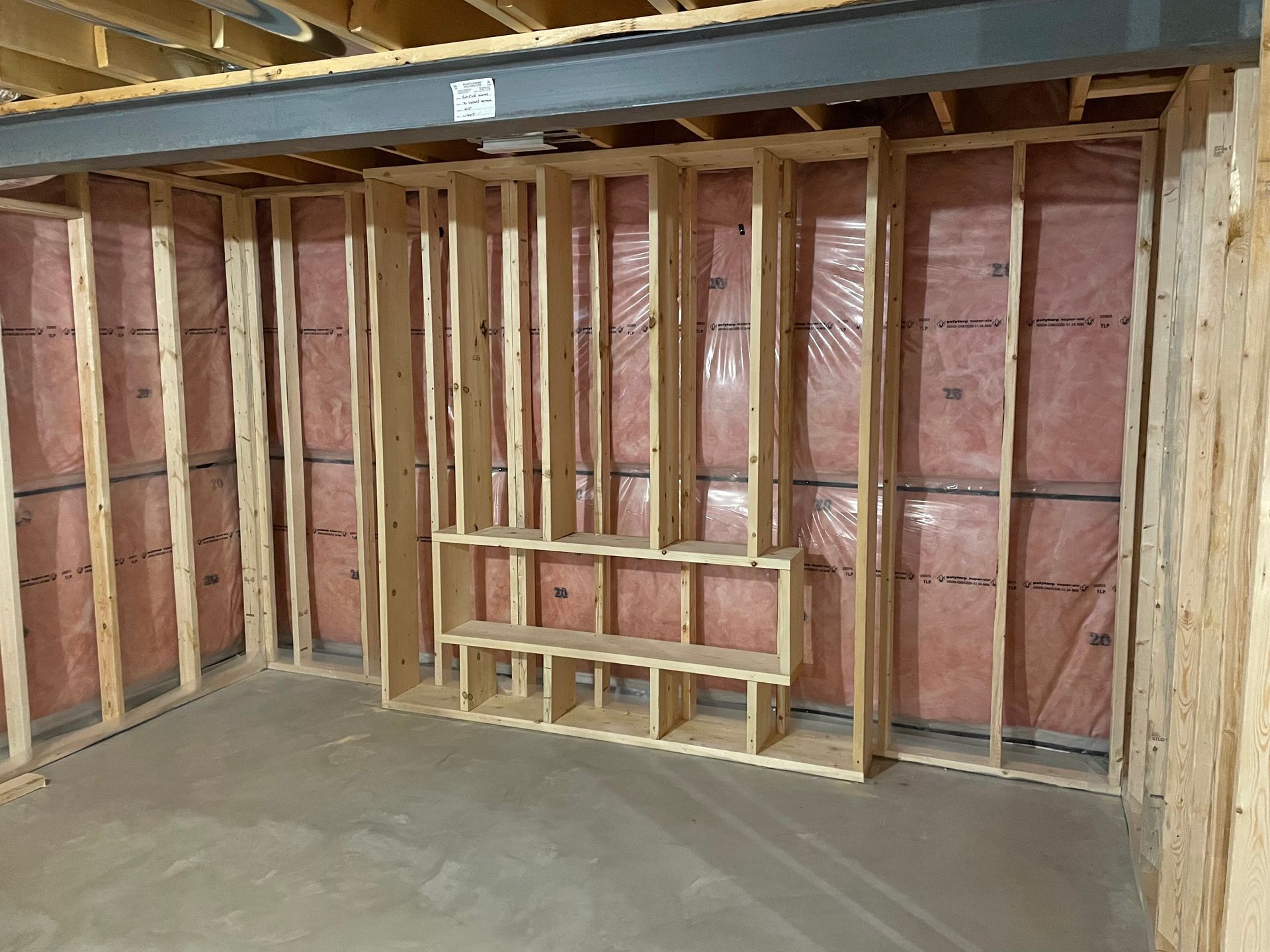 A room with a lot of wooden frames and shelves.