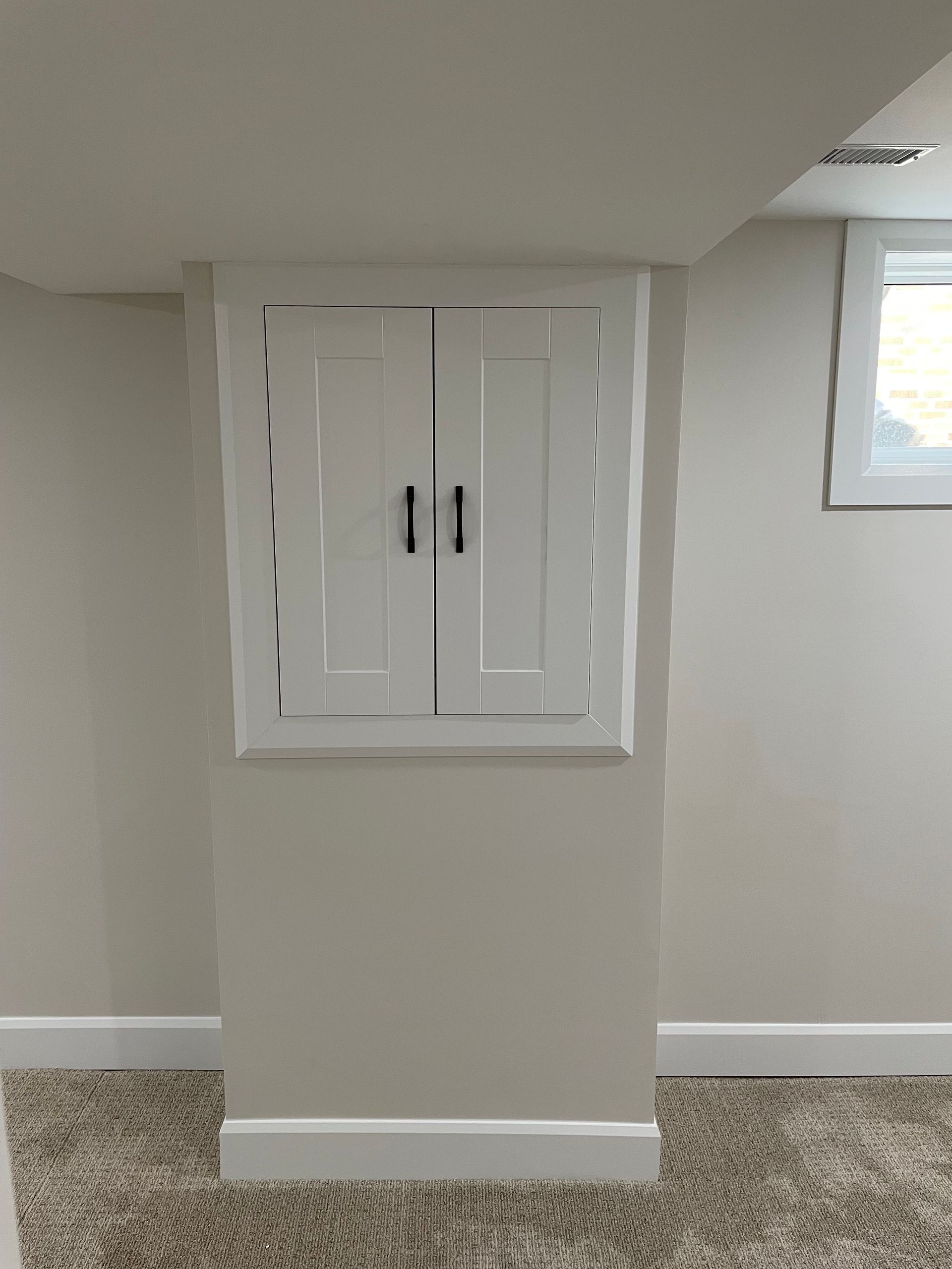 There is a window in the corner of the room.