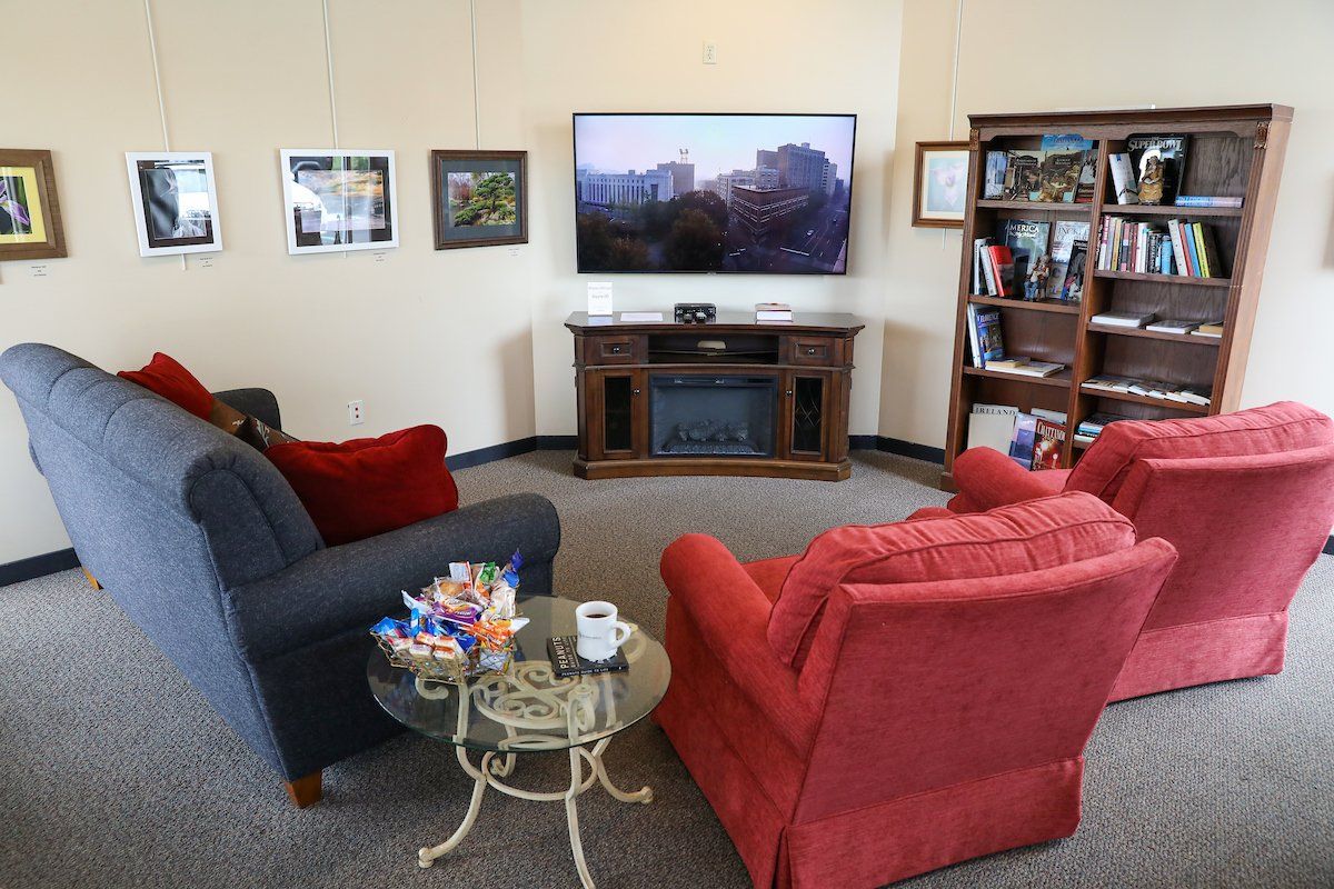 A living room filled with furniture and a flat screen tv.