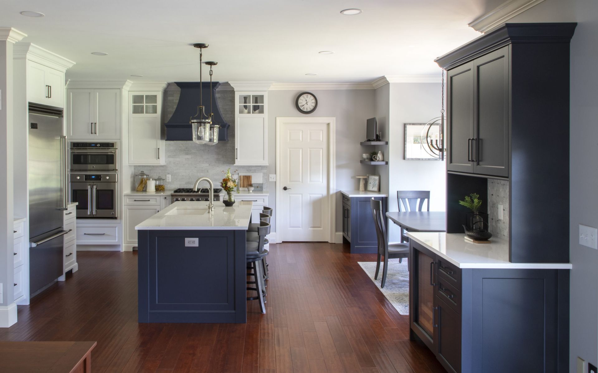 A kitchen with a large island in the middle of the room.