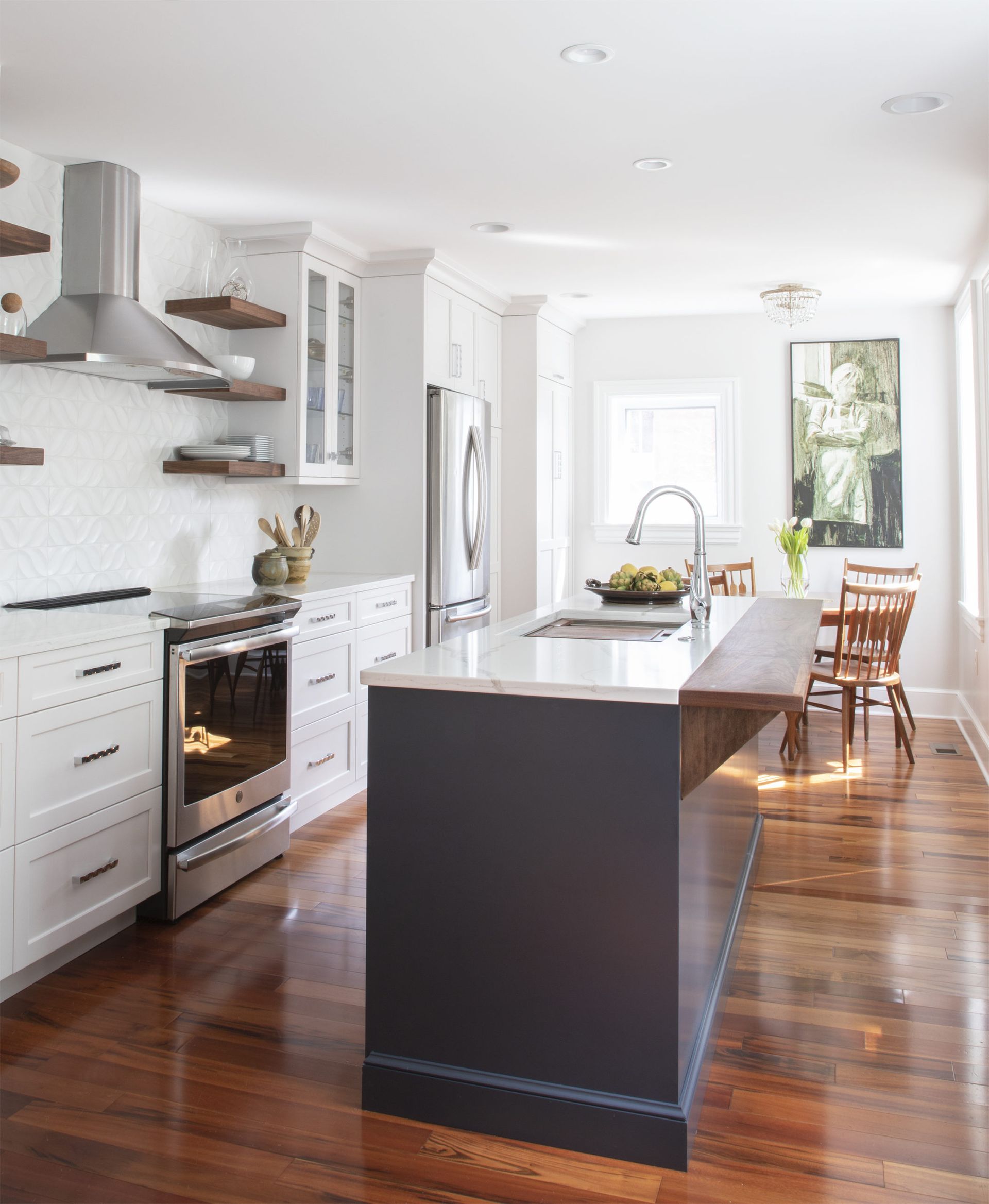 A kitchen with a large island in the middle of it