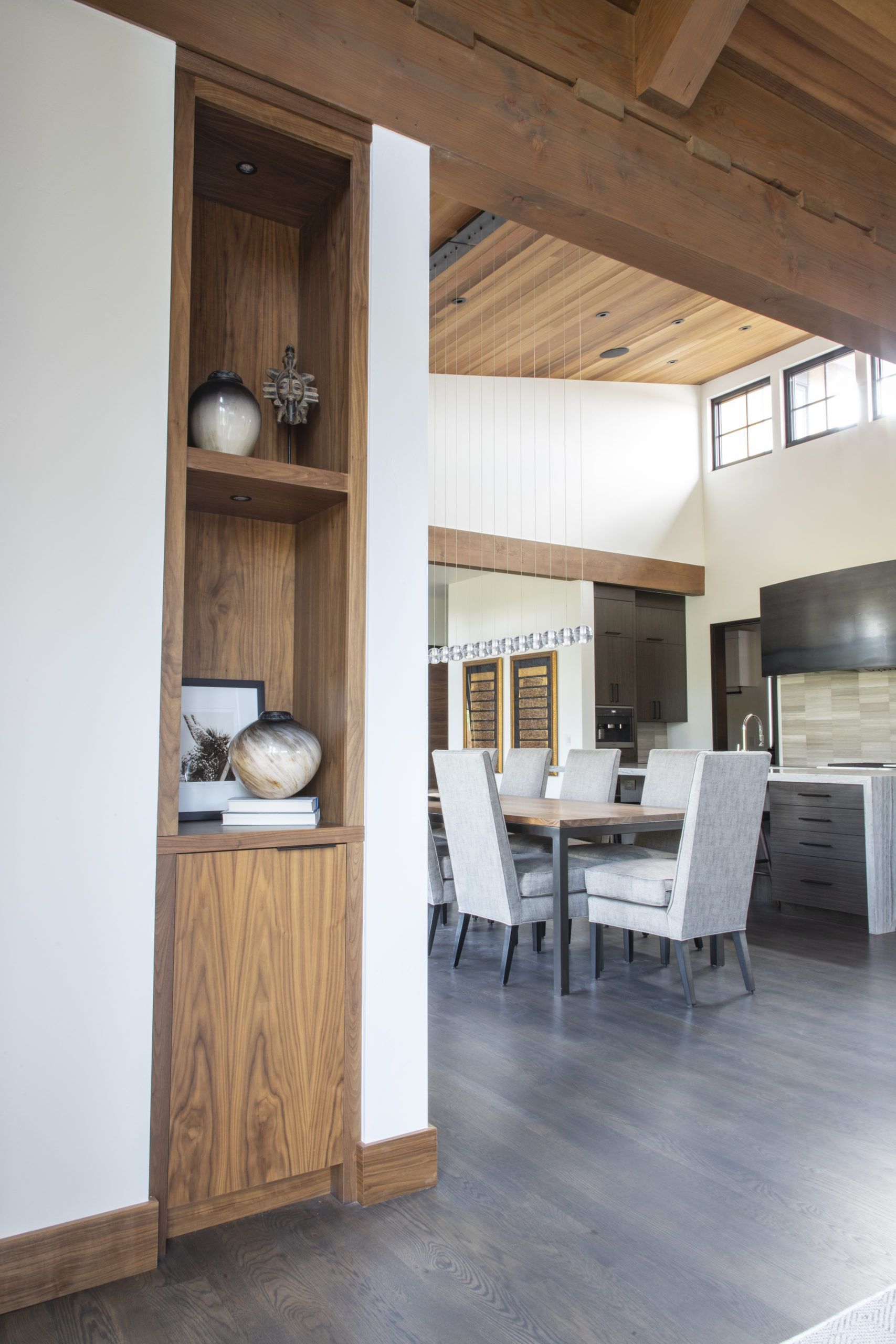 A dining room with a table and chairs in it