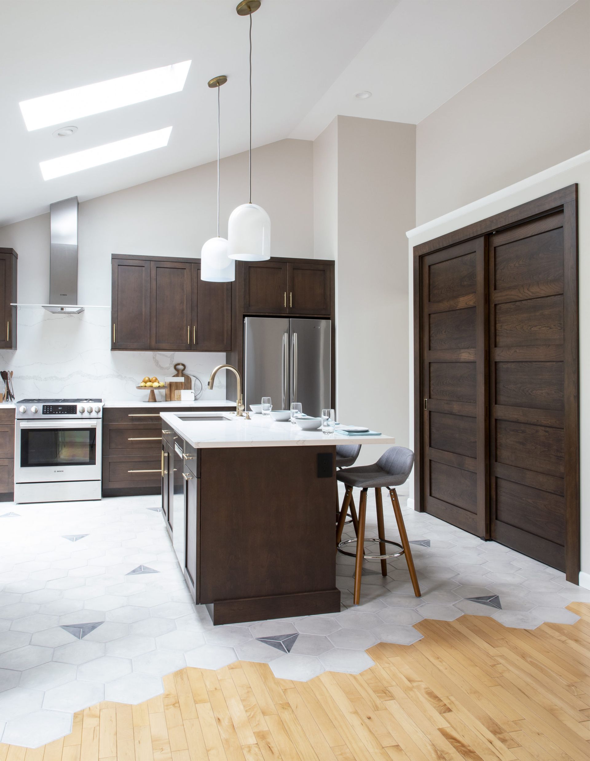A kitchen with stainless steel appliances and wooden cabinets
